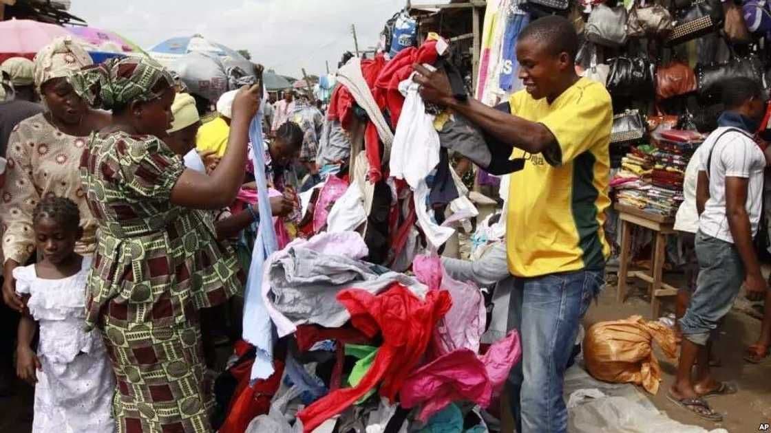 Nigerian woman shopping Okrika secondhand clothes |legitng